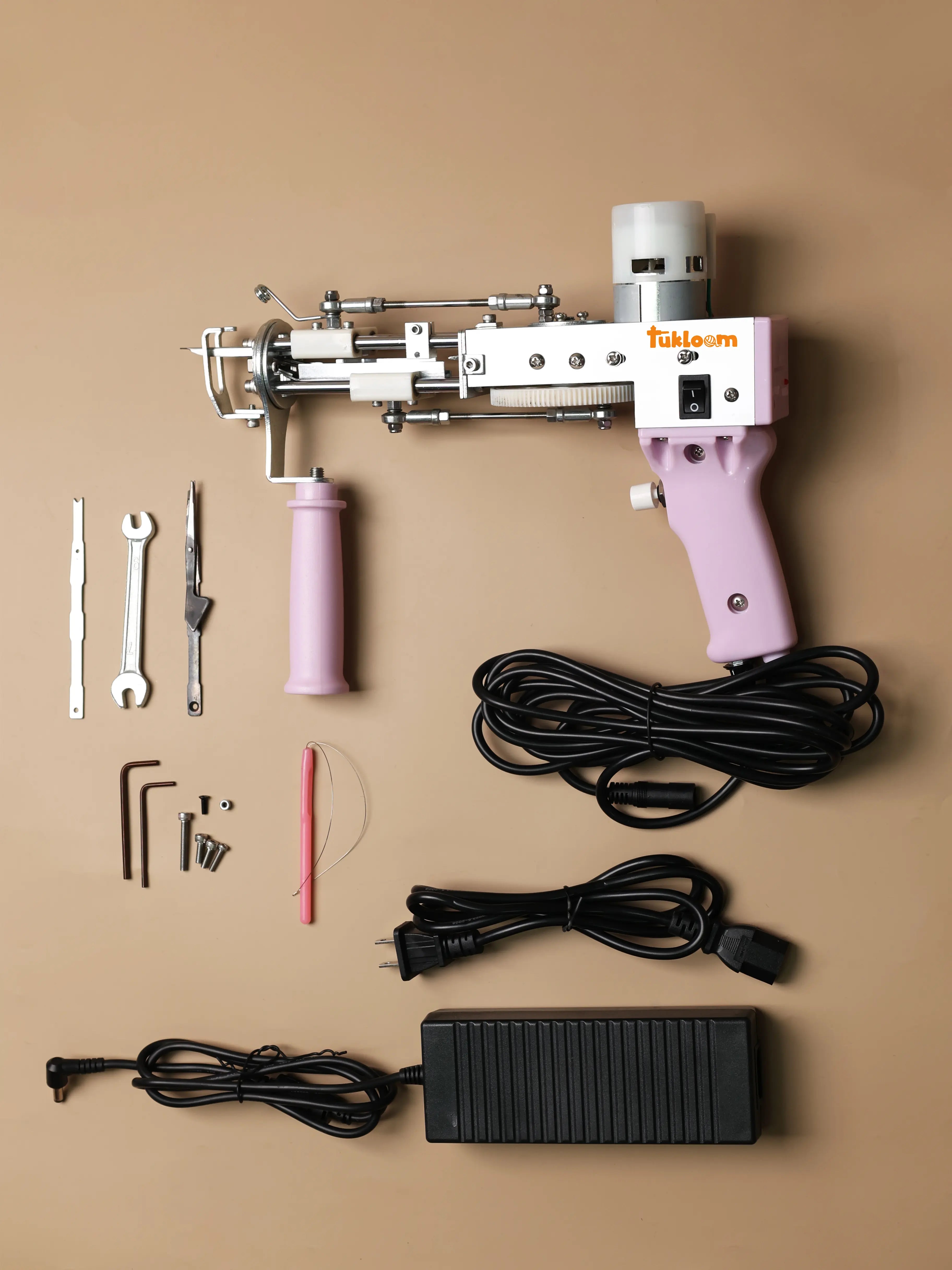 AK-1 tufting gun with threading tool and spare blade set — beginner-friendly tufting tool