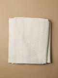 Close-up front view of white primary tufting cloth showing tight, even weave for beginner and professional rug making.