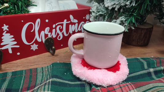 Finished tufted cherry coaster holding a mug in a holiday setting, used as the cover image for Tukloom’s “How to Make a Tufted Coaster” tutorial.